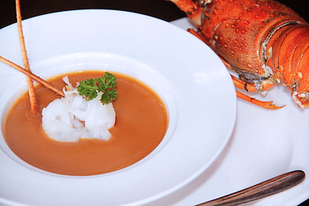 dish on white plate beside cooked crab thumbnail