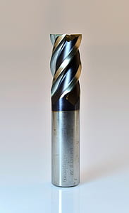 gray drill bit on white panel thumbnail