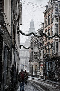 white concrete building during snowy weather thumbnail