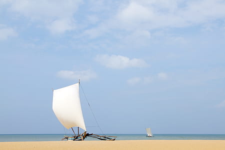 brown and white sailboat during daytime thumbnail