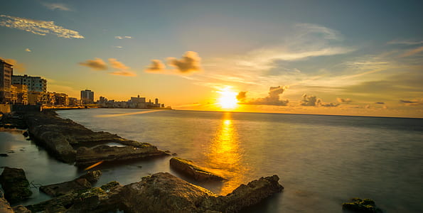 sunset and body of water thumbnail