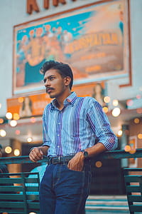 Photo of Man Leaning on Steel Bench thumbnail