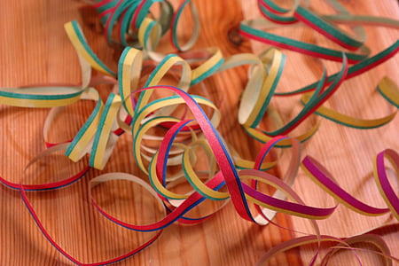 tangled ribbons on wooden surface thumbnail
