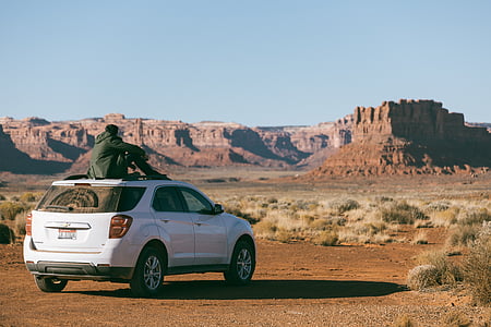 white Chevrolet SUV in Grand Canyon at daytime thumbnail