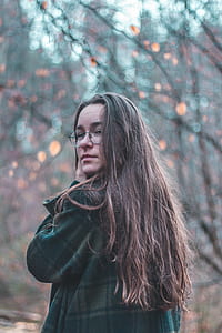 shallow focus photography of woman wearing eyeglasses thumbnail