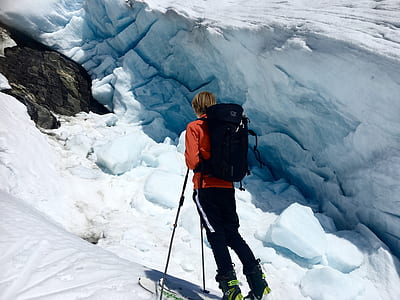 man riding ski blades with ski poles thumbnail