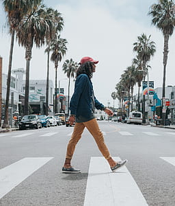 photo of man crossing on road thumbnail