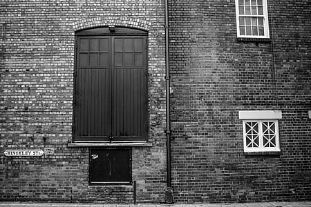 grayscale photo of bricked building thumbnail