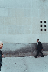 man walking on side walk thumbnail