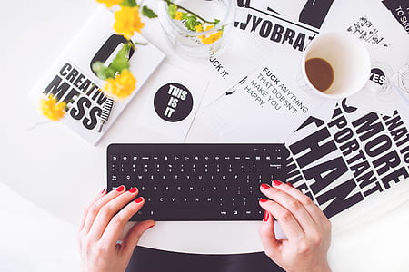 Girl writing on a black keyboard thumbnail