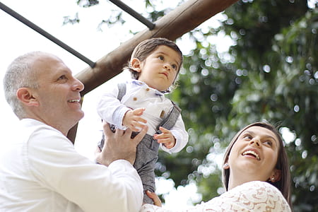 couple raising up toddler thumbnail
