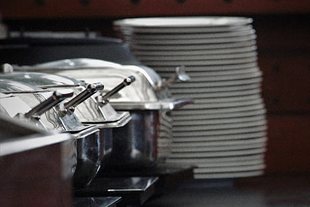 grey stainless steel buffet server near stack of white ceramic plates thumbnail