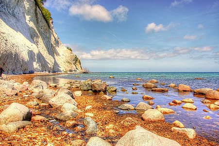 body of water with white rock formation thumbnail