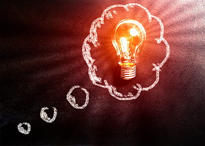 Thought Concept with Light Bulb Over Blackboard thumbnail