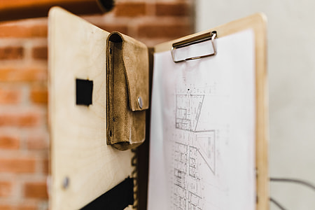 Architecture plans in an elegant leather bag thumbnail
