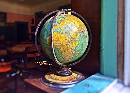 blue and yellow desk globe inside room thumbnail