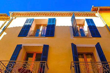 white concrete building under blue sky thumbnail