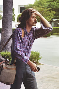 Man in Blue Button-up Long-sleeve Shirt thumbnail