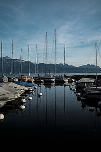 boats on body of water at daytime thumbnail
