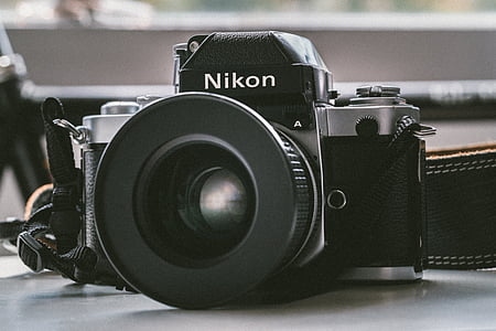 black Nikon MILC on white panel thumbnail