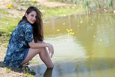 woman wearing blue and white floral top thumbnail