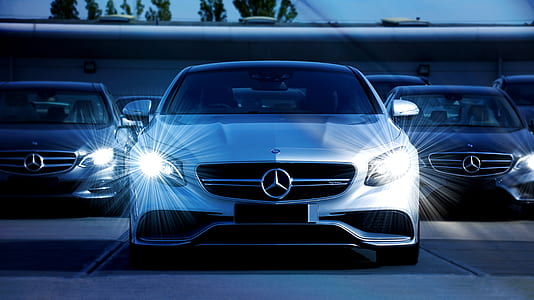 three black, silver, and white Mercedes-Benz cars thumbnail