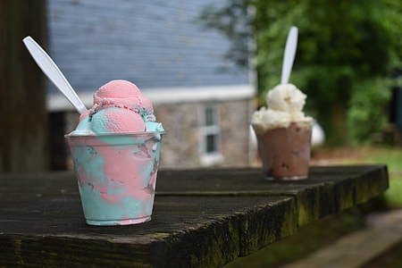 pink and white ice creams in clear plastic cups thumbnail