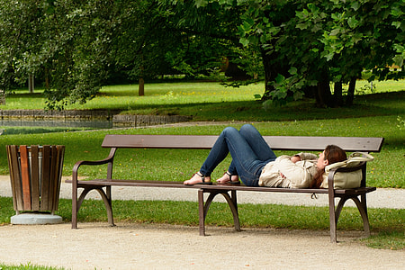 woman sleeping on bench thumbnail