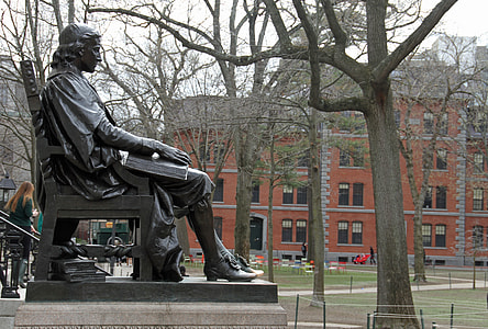 sitting man with book statue thumbnail