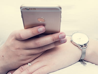 person holding rose gold iPhone 6s thumbnail