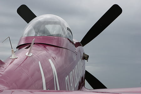 closeup photo of red and white plane thumbnail