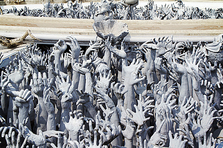 close-up photo of people raising hands thumbnail