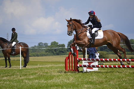 two women riding horses thumbnail