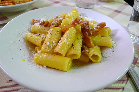 cooked tube pasta with toppings on plate thumbnail