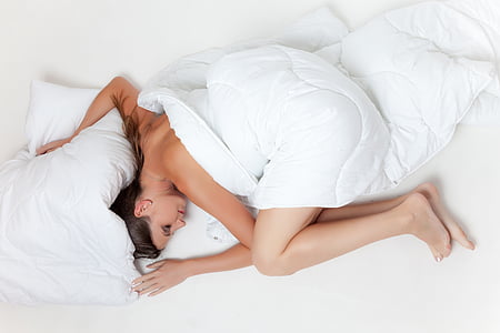 woman sleeping on white mattress thumbnail
