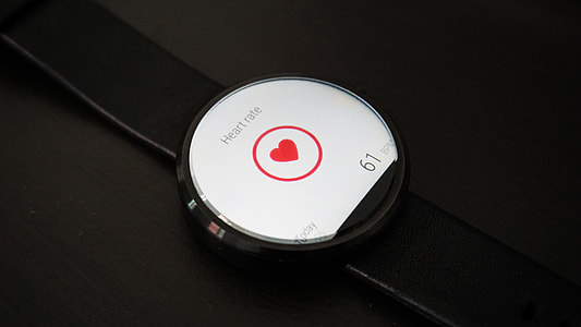 close-up photo of fitness tracker turned on displaying heart rate monitor application thumbnail