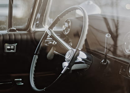 grayscale photography of steering wheel thumbnail