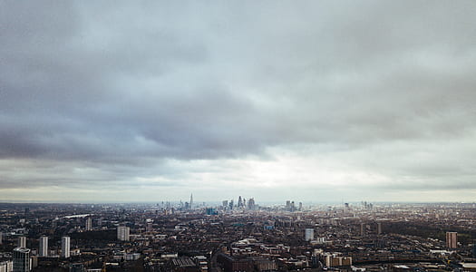 gray clouds over city buildings thumbnail