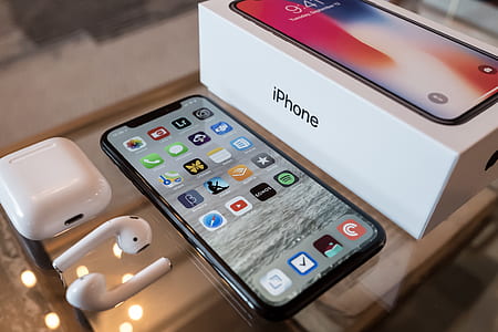 space gray iPhone X with box and AirPods thumbnail