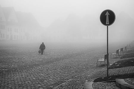 person walking on road with fog thumbnail