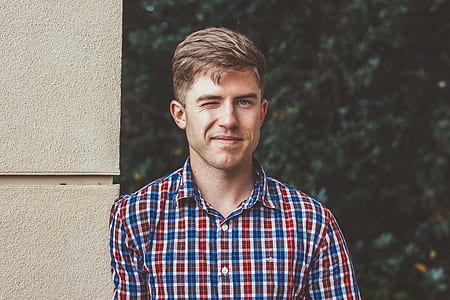 man wearing red and blue plaid dress shirt thumbnail