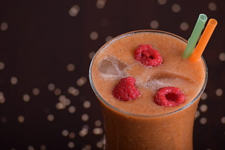 orange smoothie in clear drinking glass thumbnail