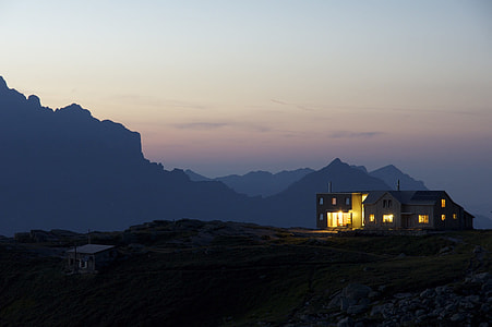 gray house near mountain thumbnail