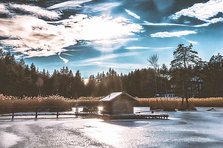 Brown Shack in the Middle of Frozen Lake thumbnail