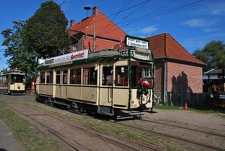 beige and green train during daytime thumbnail