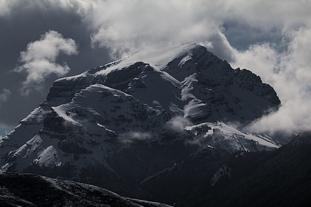 grayscale photo of mountain filled with fogs thumbnail