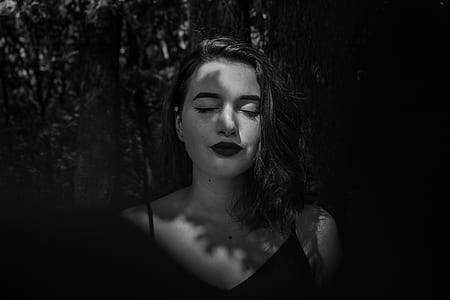 grayscale photo of woman wearing spaghetti strap top thumbnail