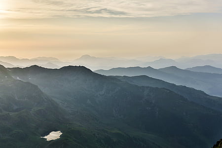 mountains covered with fog during daytime thumbnail