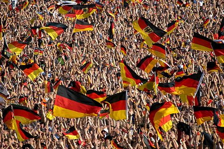crowd holding Germany flags thumbnail