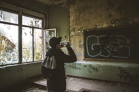 man taking photo of graffiti thumbnail